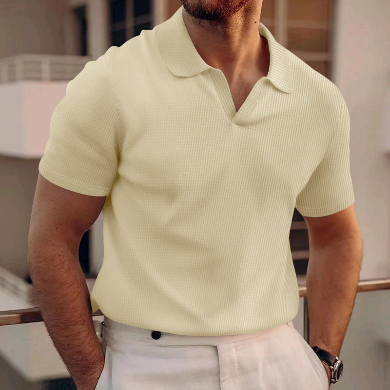 A man wearing a stylish v-neck polo shirt for men in light yellow, showcasing a comfortable fit and unique design.